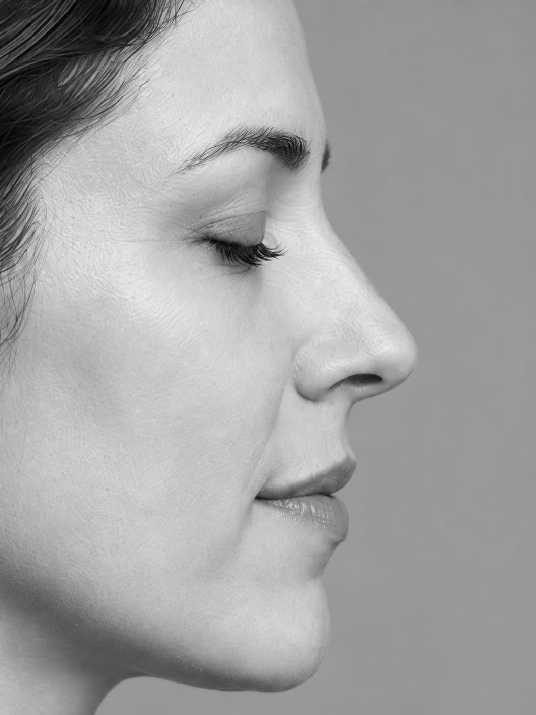 Monochrome close side profile focused on the nose bridge and tip